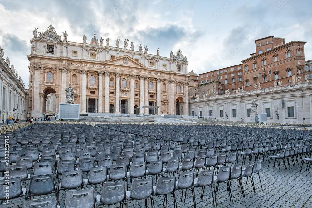 View of the Papal Basilica of Saint Peter in the Vatican. Chairs in front of St. Peter's Basilica, Vatican City, Rome, Italy