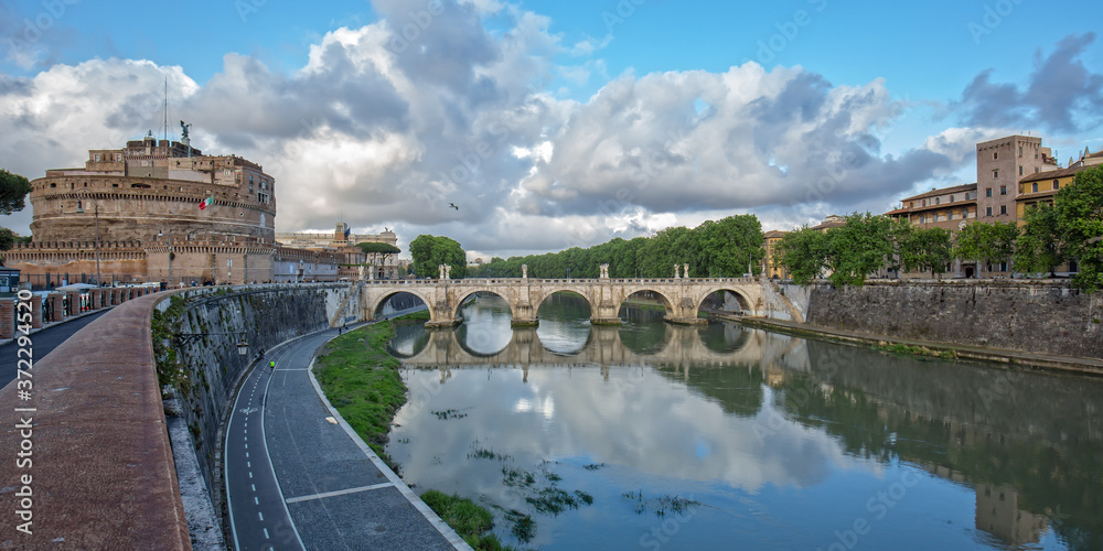 Castel Sant'Angelo and bridge with beautiful reflections on the Tiber river .View of Castle Sant Angelo (Mausoleum of Hadrian), bridge Sant Angelo and river Tiber in Rome, Italy