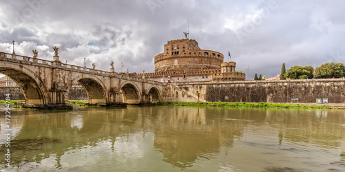 Famous view of Sant Angelo Bridge and the Castle Sant Angelo. View of Castel Sant Angelo (Mausoleum of Hadrian), bridge Sant Angelo and river Tiber in Rome, Italy