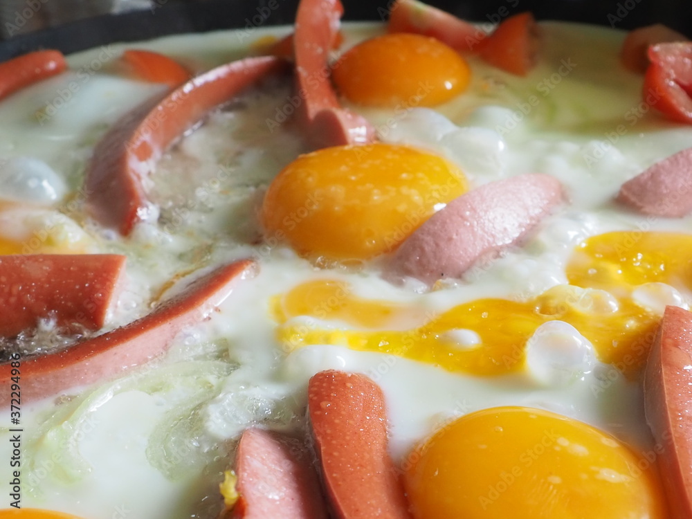 fried eggs with sausage and tomatoes. fried egg. breakfast fried eggs with sausage and tomatoes. fried egg. breakfast