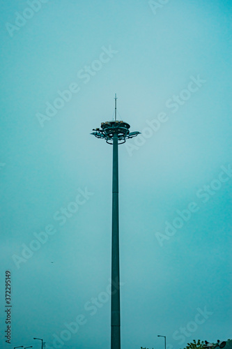 Lamp post on blue sky background