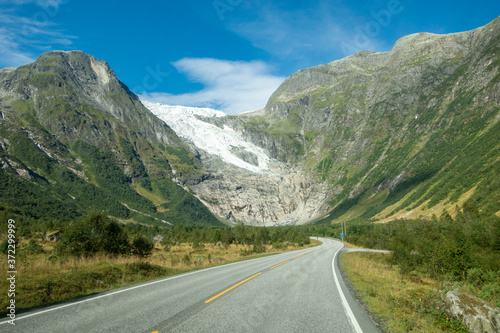 Norwegian mountain road with Josteldalsbreen glacier in the background