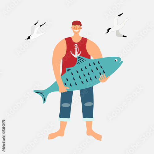 The sailor stands with a large blue fish in his hands. photo