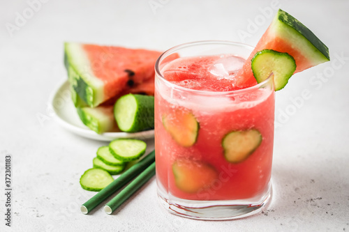 Refreshing summer watermelon cucumber gin and tonic. Space for text.