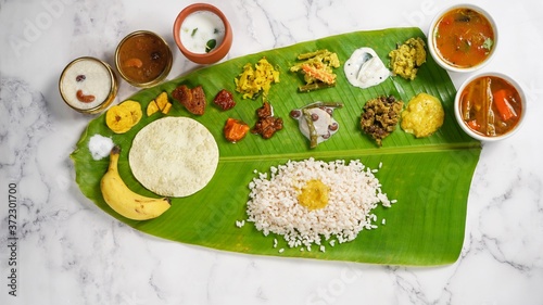 Onam Feast / Kerala Ona - Sadya served in banana leaf - South Indian vegetarian meal photo