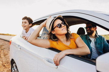 Family road trip. Latin family traveling locally by car.