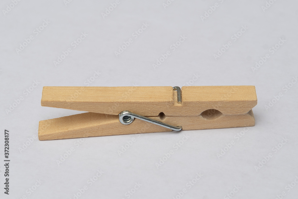 wooden clothespins on white background close clamp