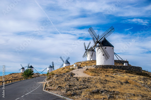 Photo of some beautiful and historic windmills located in Consuegra, Toledo, Spain during a sunny day of summer in a natural place. 