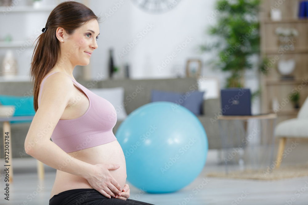 Fototapeta premium young pregnant woman after doing yoga