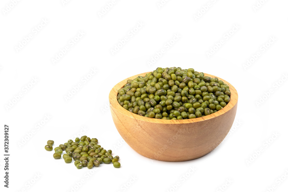 Closeup green mung beans in wooden bowl isolated on white background Closeup green mung beans in wooden bowl isolated on white background