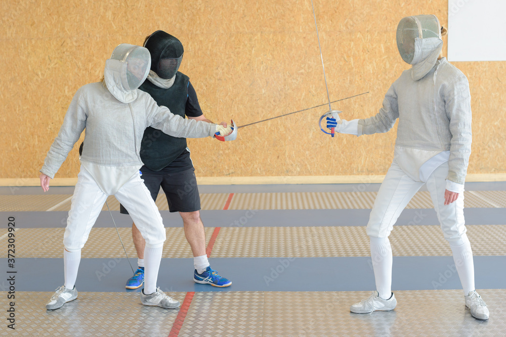 a couple during fencing tournament a couple during fencing tournament