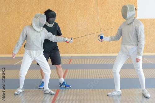 a couple during fencing tournament