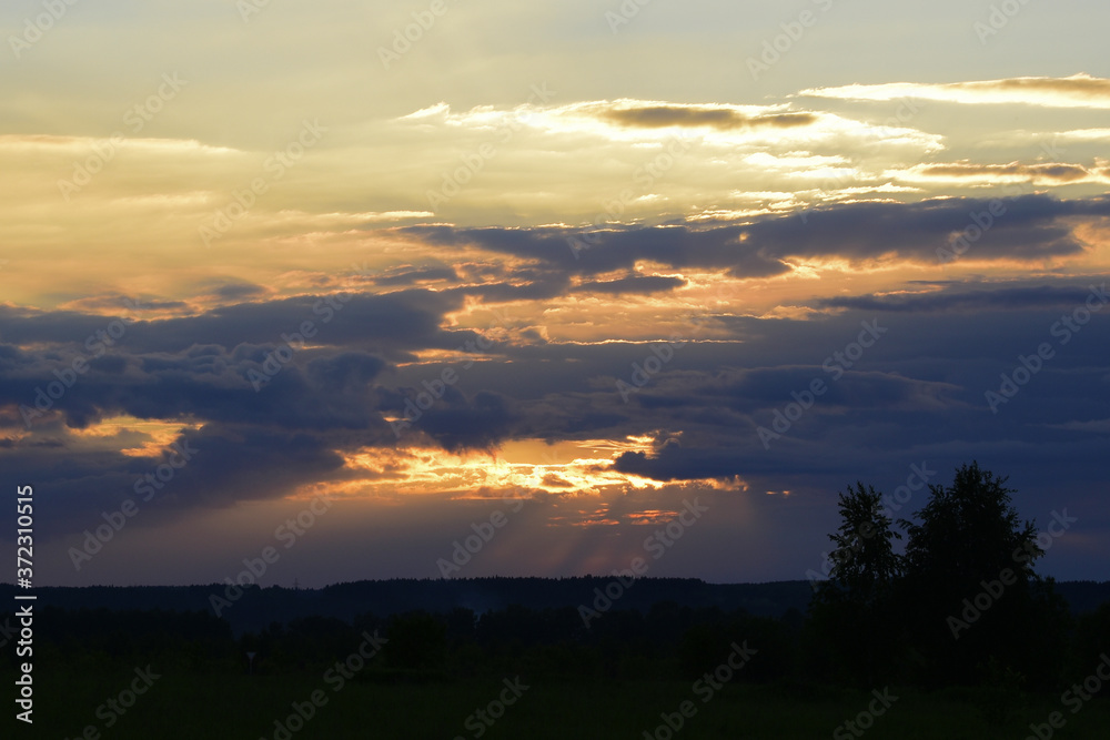 Cloudy sunset. A cool summer evening in the Western Urals.