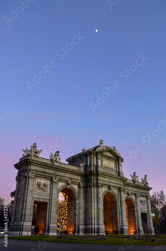 The Alcala door at the afternoon sky photo