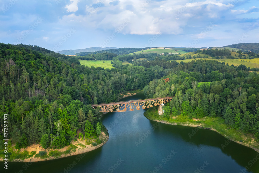 Aerial view of Pilchowicki bridge - old steel truss railway bridge over the Pilchowickie Lake in Lower Silesia, Poland