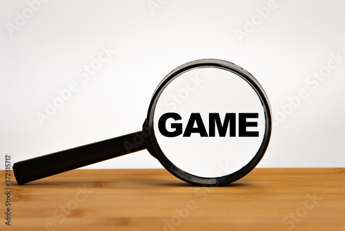 Focused on business concept. Magnifier glass with word game on wooden table. Business concept. Search idea