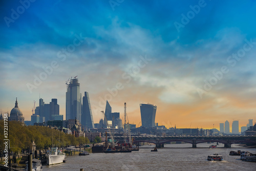 A view along the Thames in London, UK at dusk.