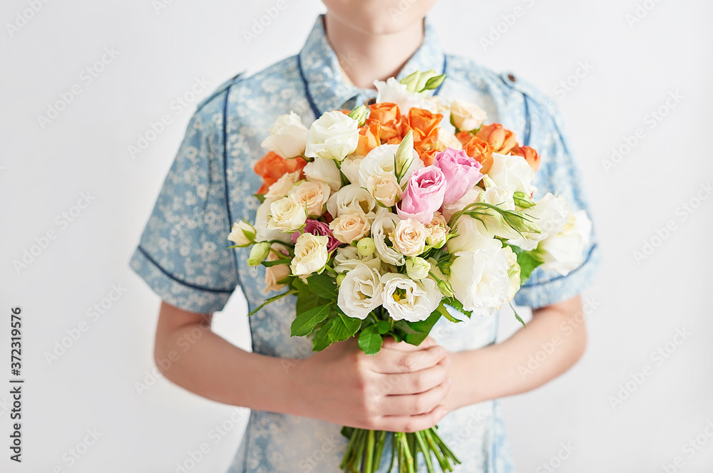 Child boy with bouquet of flowers. Mother's Day Greeting Card. Happy mothers day frame background. Spring card template. Happy Birthday or Valentine. Women's Day. Copy space. Child gives bouquet Child boy with bouquet of flowers. Mother's Day Greeting Card. Happy mothers day frame background. Spring card template. Happy Birthday or Valentine. Women's Day. Copy space. Child gives bouquet