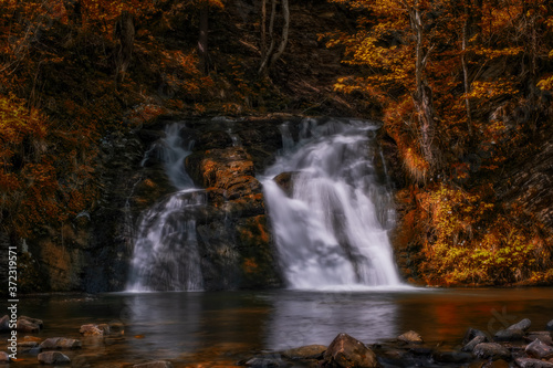 wonderful waterfall on the mountain river Carpathians. Gurkalo or Hurkalo Waterfall  Carpathian Mountains  National Park of Skole Beskydy  Ukraine. autumn 2020. Long exposure shot.