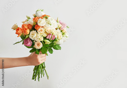 Child boy with bouquet of flowers. Mother's Day Greeting Card. Happy mothers day frame background. Spring card template. Happy Birthday or Valentine. Women's Day. Copy space. Child gives bouquet
