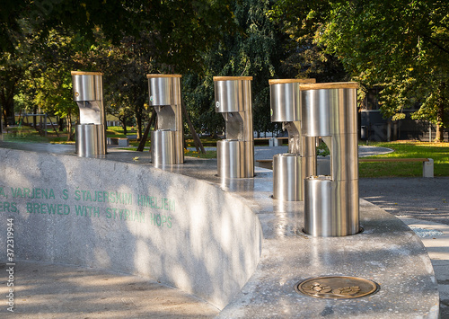 Žalec, Slovenia - October 01, 2016:  Public beer fountain in the town park at Žalec, Slovenia.