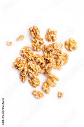 Peeled walnuts on a white background