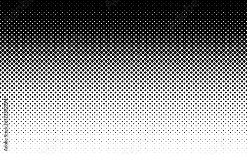 Vector halftone dots background. Black and white comic pattern.