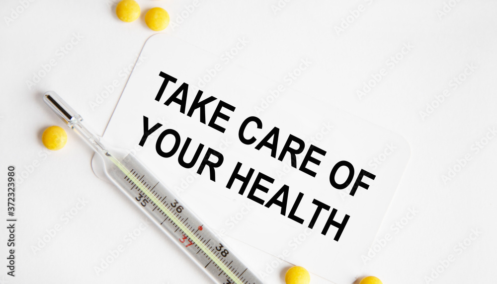 Obraz premium Take care of your health. The inscription is made in a notebook, next to a notebook tablet and stethoscope.