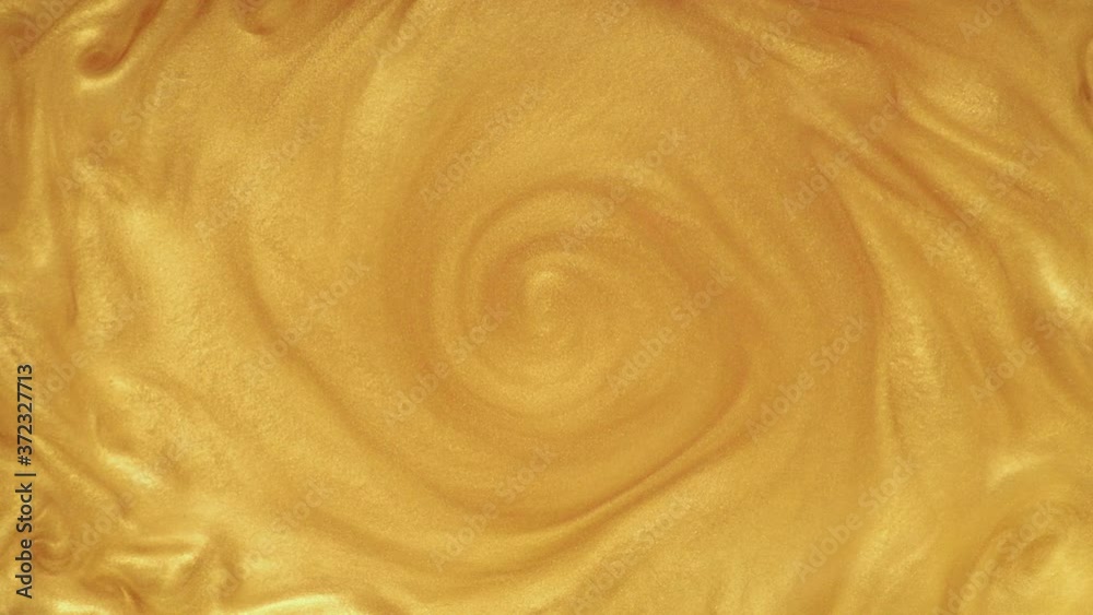 Yellow swirl mixing gold paint, animation effect for transition. Gold background