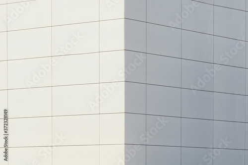 Urban abstract architecture. Close up of a modern building white facade.