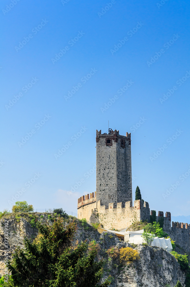 View of the walls and the tower of Scaliger Castle in Malcesine. Lake Garda northern Italy