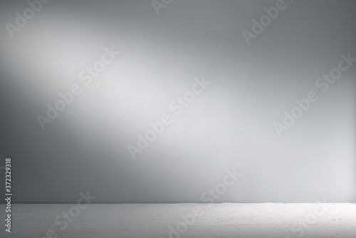 Cement background with beam of light. Background for product presentation.