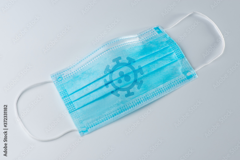 Surgical face mask with coronavirus print on white background