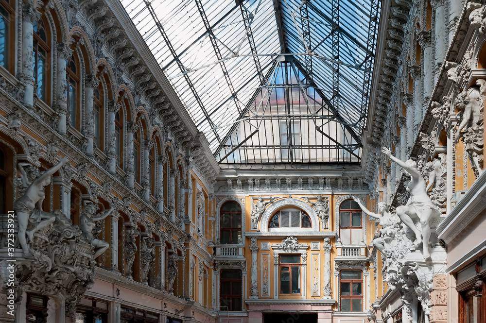 Shopping arcade with decorative sculptures of Odessa Passage, a passage and a hotel on Deribasivska Street in the centre of Odessa, Ukraine