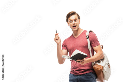 Excited student holding pen and notebook isolated on white © LIGHTFIELD STUDIOS