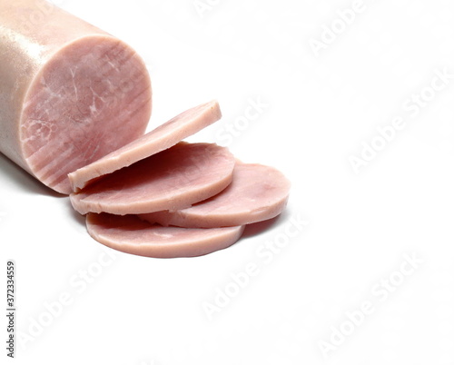 Salami isolated. Boiled ham sausage sliced on white background