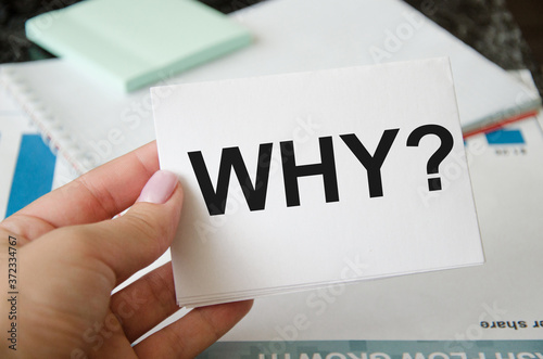  man holding a white sheet with the words who