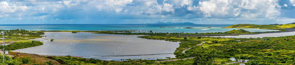 A panorama view from Paradise view across lakes towards Orient Bay, St Martin