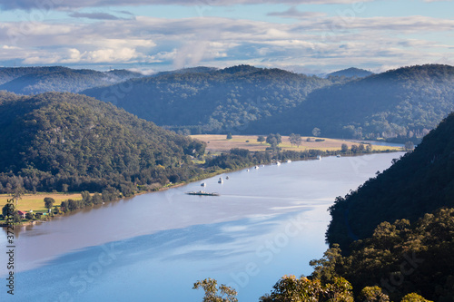 Fototapeta Naklejka Na Ścianę i Meble -  A car ferry crossing The Hawkesbury River in regional New South Wales in Australia