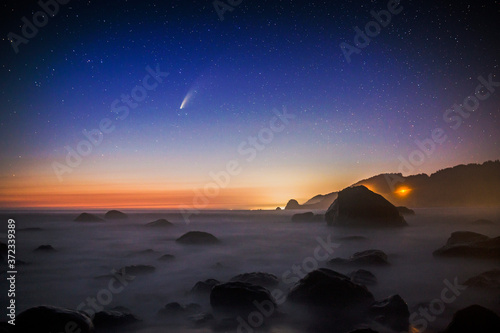 The Comet NEOWISE over the beaches of Redwood National Park in California. photo