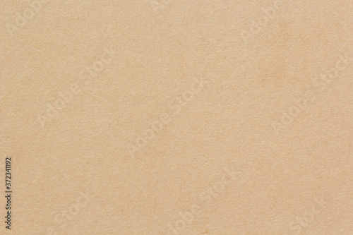 Brown paper background. Empty cardboard texture. Craft sheet