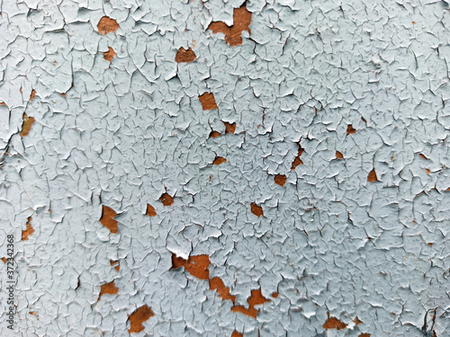 Photograph of the texture of old paint. Texture for the interior in the loft style. Cracked paint.