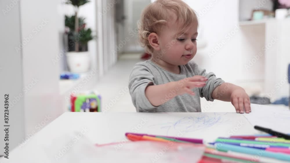 Young girl drawing at home with felt tips Young girl drawing at home with felt tips