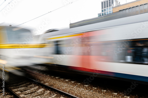 Trains moving fast in the station