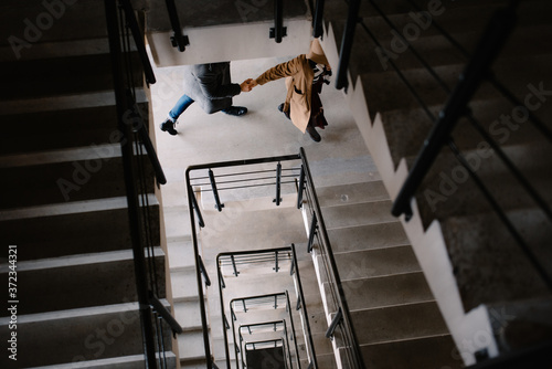 people quickly run up the stairs