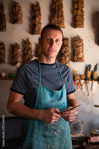 Proud woodcraftsman posing for the camera photo