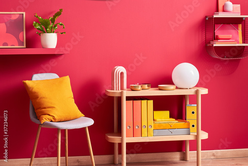Chair and table with decorations in stylish room
