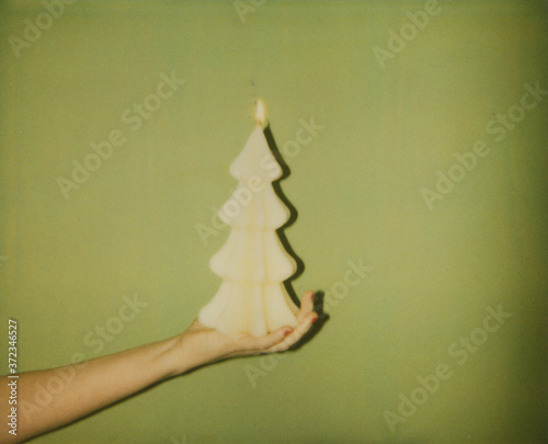Old Polaroid photo of Christmas tree shaped candle