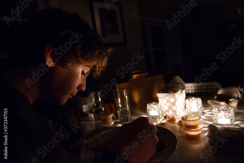 Family Eats Take-Out Dinner During Power Outage photo