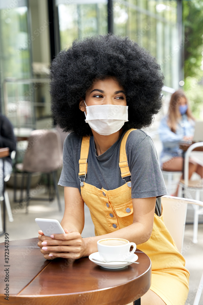 Happy African American young hipster gen z teen girl with Afro hair ...